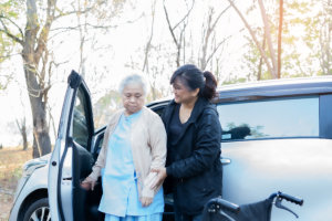 caregiver assist an elderly woman